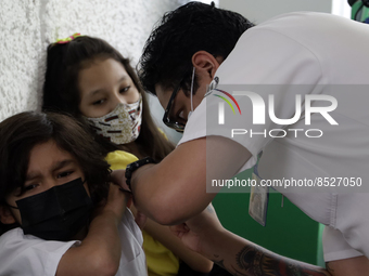  A child receives a Pfizer first dose at the  Portales Health Center during a health campaign to children under 9 years of age  at the start...