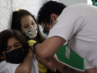  A child receives a Pfizer first dose at the  Portales Health Center during a health campaign to children under 9 years of age  at the start...