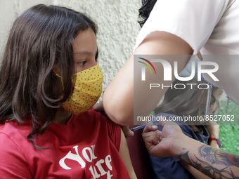  A child receives a Pfizer first dose at the  Portales Health Center during a health campaign to children under 9 years of age  at the start...