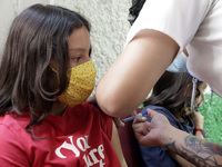  A child receives a Pfizer first dose at the  Portales Health Center during a health campaign to children under 9 years of age  at the start...