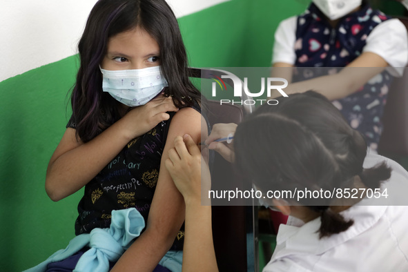  A child receives a Pfizer first dose at the  Portales Health Center during a health campaign to children under 9 years of age  at the start...