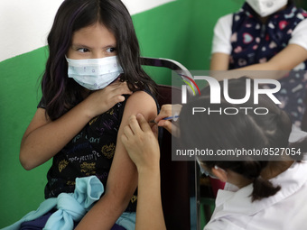  A child receives a Pfizer first dose at the  Portales Health Center during a health campaign to children under 9 years of age  at the start...