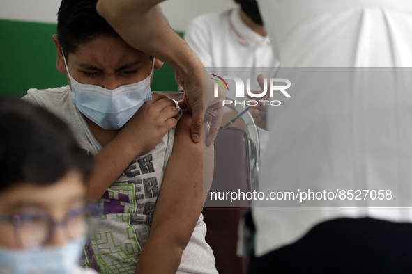  A child receives a Pfizer first dose at the  Portales Health Center during a health campaign to children under 9 years of age  at the start...