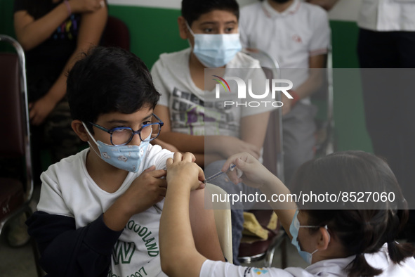  A child receives a Pfizer first dose at the  Portales Health Center during a health campaign to children under 9 years of age  at the start...