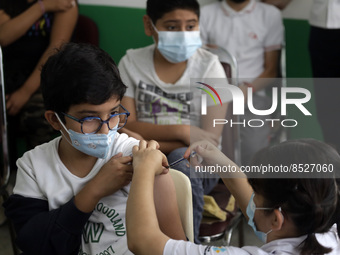  A child receives a Pfizer first dose at the  Portales Health Center during a health campaign to children under 9 years of age  at the start...