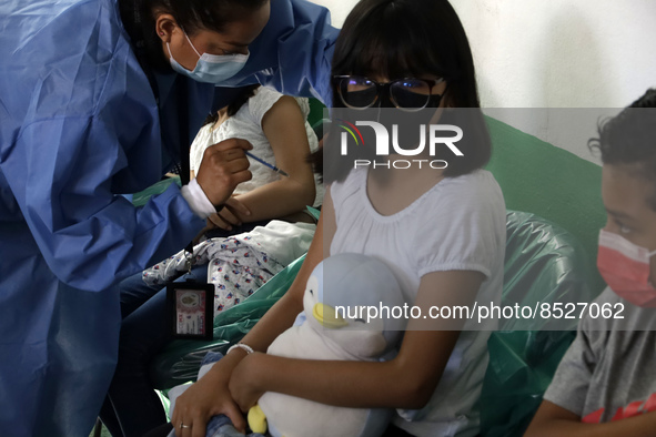  A child receives a Pfizer first dose at the  Portales Health Center during a health campaign to children under 9 years of age  at the start...