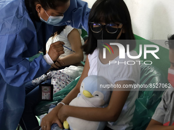  A child receives a Pfizer first dose at the  Portales Health Center during a health campaign to children under 9 years of age  at the start...