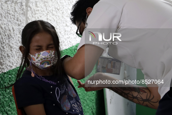  A child receives a Pfizer first dose at the  Portales Health Center during a health campaign to children under 9 years of age  at the start...