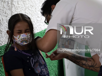  A child receives a Pfizer first dose at the  Portales Health Center during a health campaign to children under 9 years of age  at the start...