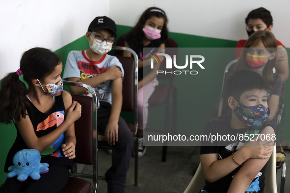  A child receives a Pfizer first dose at the  Portales Health Center during a health campaign to children under 9 years of age  at the start...