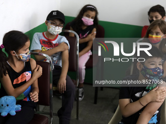  A child receives a Pfizer first dose at the  Portales Health Center during a health campaign to children under 9 years of age  at the start...