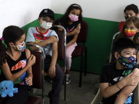  A child receives a Pfizer first dose at the  Portales Health Center during a health campaign to children under 9 years of age  at the start...