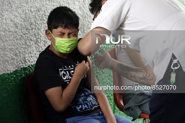  A child receives a Pfizer first dose at the  Portales Health Center during a health campaign to children under 9 years of age  at the start...