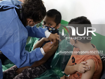  A child receives a Pfizer first dose at the  Portales Health Center during a health campaign to children under 9 years of age  at the start...