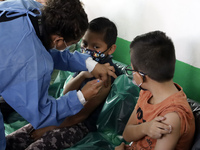  A child receives a Pfizer first dose at the  Portales Health Center during a health campaign to children under 9 years of age  at the start...