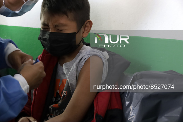  A child receives a Pfizer first dose at the  Portales Health Center during a health campaign to children under 9 years of age  at the start...