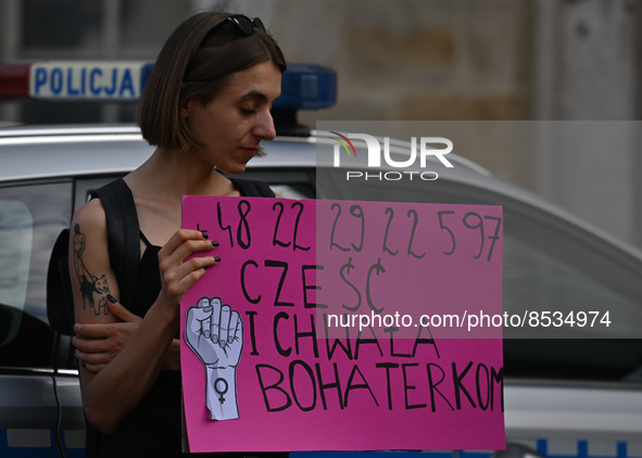 An activist holds a placard with words 'Praise to the heroines'.
Polish activist, Justyna Wydrzynska is facing three years in prison for giv...