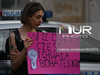 An activist holds a placard with words 'Praise to the heroines'.
Polish activist, Justyna Wydrzynska is facing three years in prison for giv...