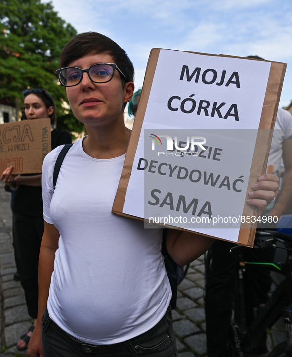 A pregnant activist holds a placard with words 'My daughter will decide for herself'.
Polish activist, Justyna Wydrzynska is facing three ye...