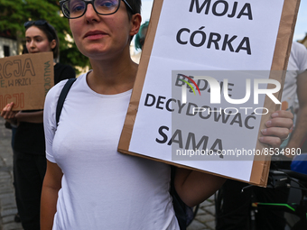 A pregnant activist holds a placard with words 'My daughter will decide for herself'.
Polish activist, Justyna Wydrzynska is facing three ye...