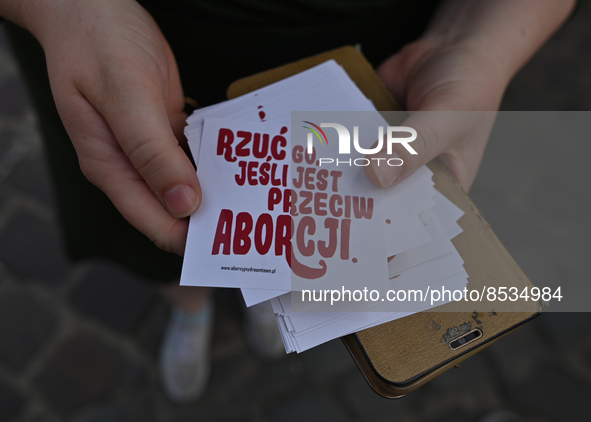 An activist holds stickers with words 'Drop him if he's against abortion'.
Polish activist, Justyna Wydrzynska is facing three years in pris...