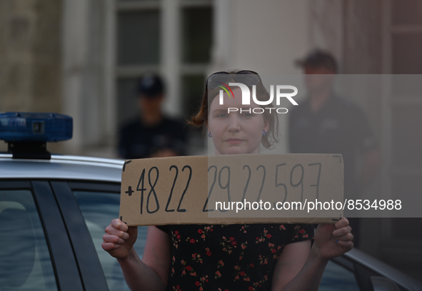 An activist holds a sign with a phone number of the national support line for Polish women.
Polish activist, Justyna Wydrzynska is facing th...