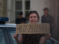 An activist holds a sign with a phone number of the national support line for Polish women.
Polish activist, Justyna Wydrzynska is facing th...