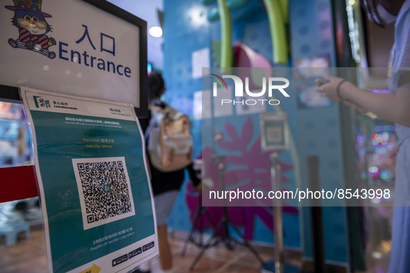 The Leave Home Safe QR code placed at the entrance of a store inside a shopping mall on July 15, 2022 in Hong Kong, China. 