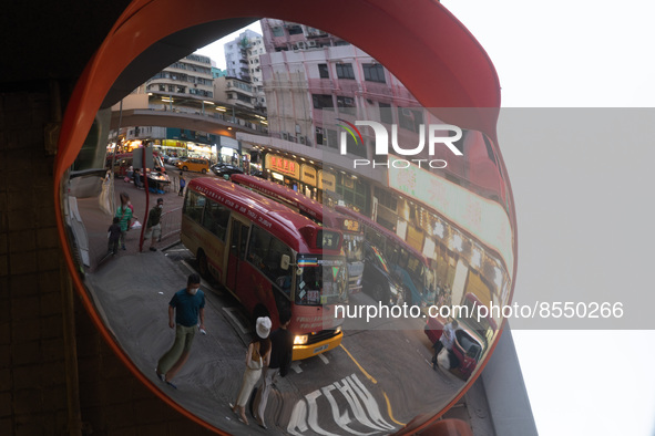 Hong Kong, China, 3 Jul 2022, A red minibus is seen parked in Mongkok in a mirror. 