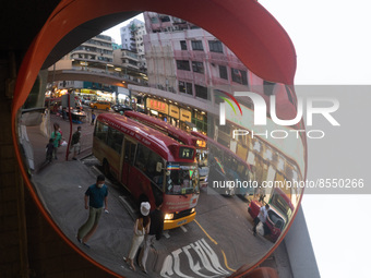 Hong Kong, China, 3 Jul 2022, A red minibus is seen parked in Mongkok in a mirror. (