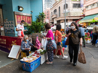 Hong Kong, China, 16 Jul 2022, Customers buy vegetables from small roadside stalls held by elderlies in Yuen Long.. (