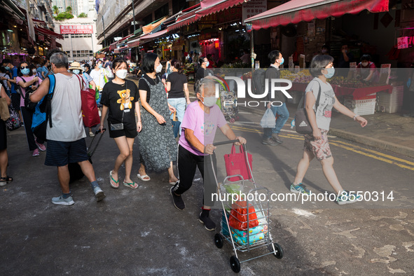 Hong Kong, China, 16 Jul 2022, People walk in a pedestrian street in Yuen Long. 