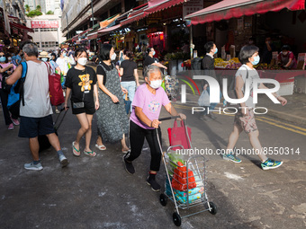 Hong Kong, China, 16 Jul 2022, People walk in a pedestrian street in Yuen Long. (