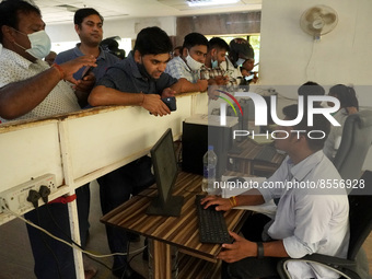 People register themselves to receive a dose during a vaccination drive against coronavirus, at a hospital in Noida on the outskirts of New...