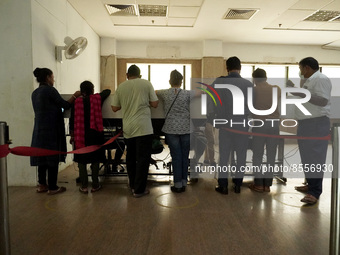 People register themselves to receive a dose during a vaccination drive against coronavirus, at a hospital in Noida on the outskirts of New...