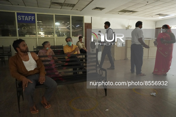 People wait at an observation area after receiving a dose during a vaccination drive against coronavirus, at a hospital in Noida on the outs...