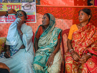 An ophthalmologist checks the eyes of a woman during a free eye-testing camp at Kumirmari village, in the Sundarbans, on July 26, 2022. The...