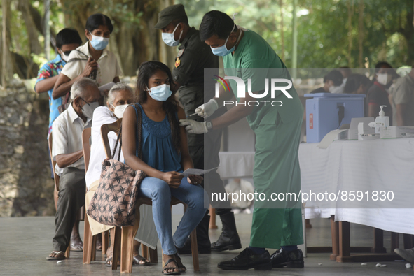 People getting  COVID 19 booster vaccines near amid economic Crisis in Colombo Sri Lanka July 27, 2022
 