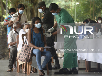 People getting  COVID 19 booster vaccines near amid economic Crisis in Colombo Sri Lanka July 27, 2022
 (