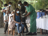 People getting  COVID 19 booster vaccines near amid economic Crisis in Colombo Sri Lanka July 27, 2022
 (