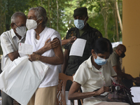 People getting  COVID 19 booster vaccines near amid economic Crisis in Colombo Sri Lanka July 27, 2022
 (