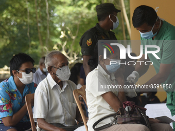 People getting  COVID 19 booster vaccines near amid economic Crisis in Colombo Sri Lanka July 27, 2022
 (