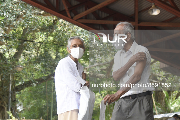 People getting  COVID 19 booster vaccines near amid economic Crisis in Colombo Sri Lanka July 27, 2022
 