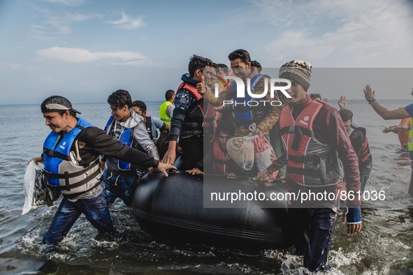 A group of migrants from Afghanistan arrive on the shore of Lesbos, Greece, on September 27, 2015.  