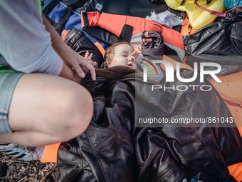 A baby lies on life jackets on the shore of Lesbos, Greece, on September 27, 2015.  (