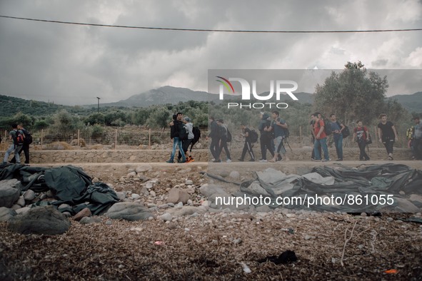 Migrants start the 40 miles walk to the city of Mitilini were they will attempt to get on a boat to Athens, Greece, on September 28, 2015.  