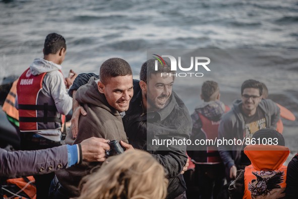 Two men embrace in a hug after a successful crossing from Turkey to Lesbos, Greece, on September 29, 2015.  