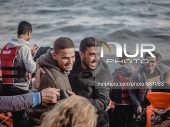 Two men embrace in a hug after a successful crossing from Turkey to Lesbos, Greece, on September 29, 2015.  (