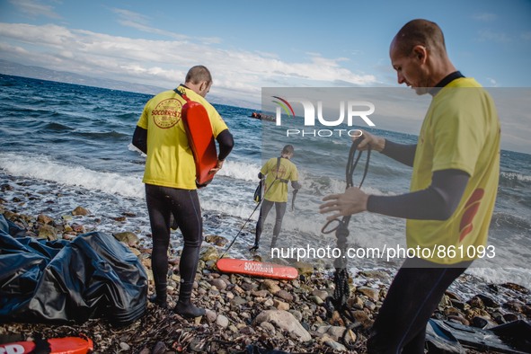 Volunteer lifeguards from Spain prepare to reach a migrant boat that has lost it’s motor and bring it safely to shore, on September 30, 2015...