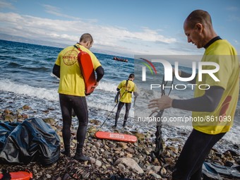 Volunteer lifeguards from Spain prepare to reach a migrant boat that has lost it’s motor and bring it safely to shore, on September 30, 2015...